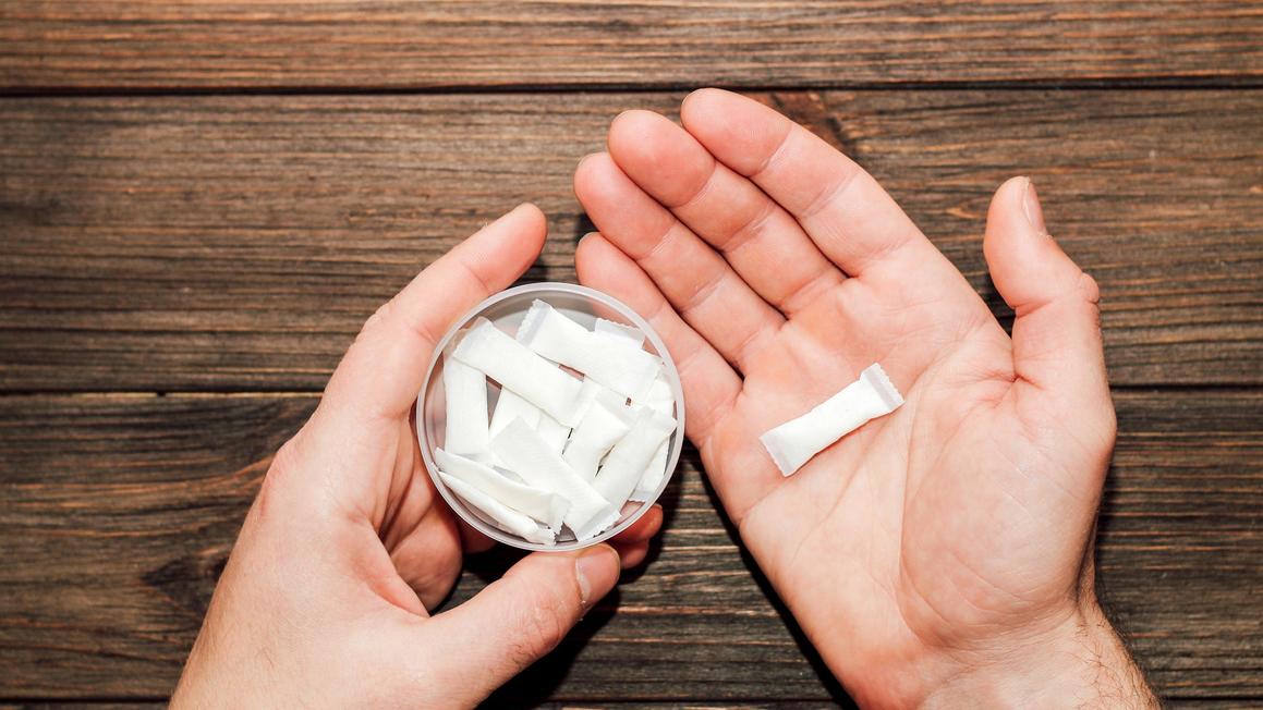 holding nicotine pouches