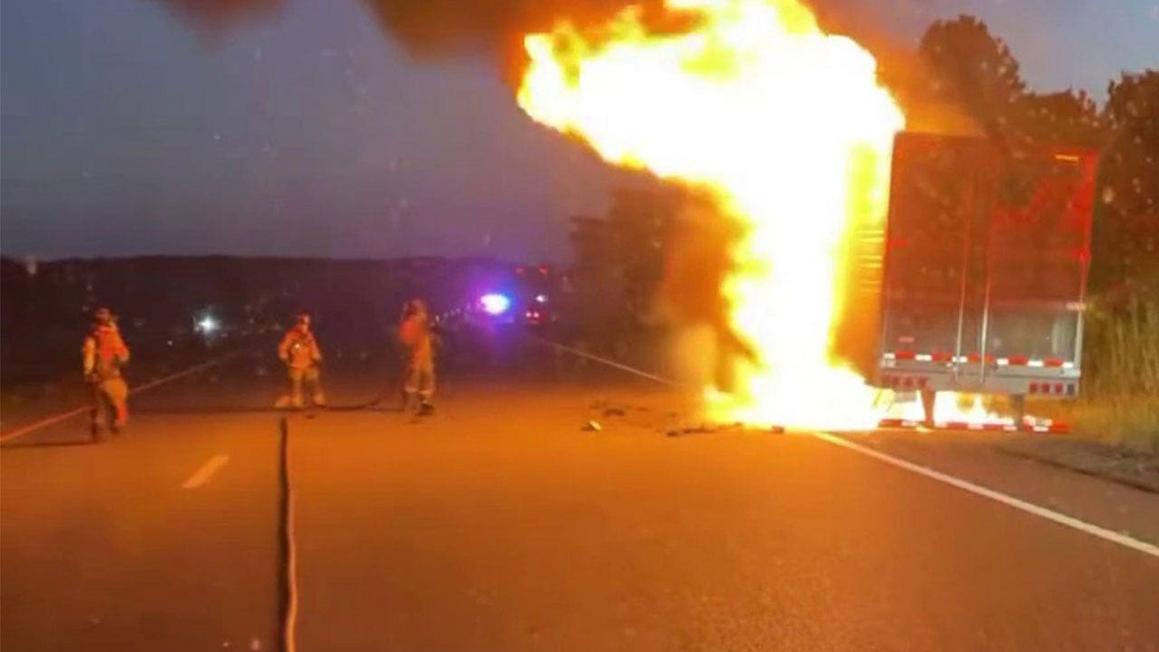 firefighters extinguishing truck fire
